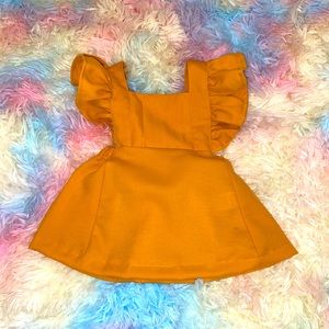 Only worn once for pictures. 0-3 mustard colored dress